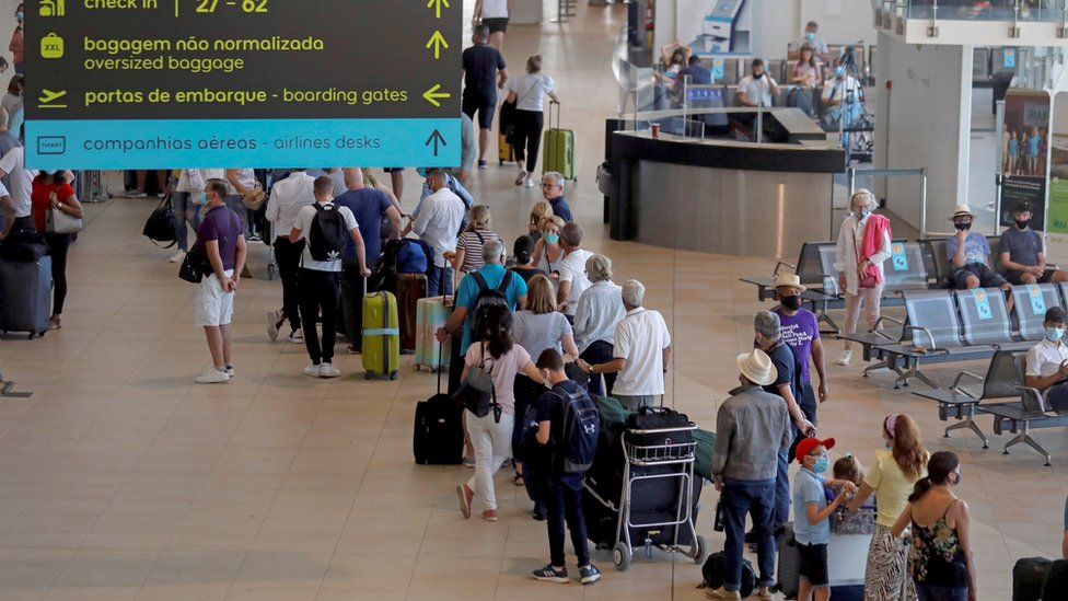 Passengers queuing at Faro Airport in Portugal