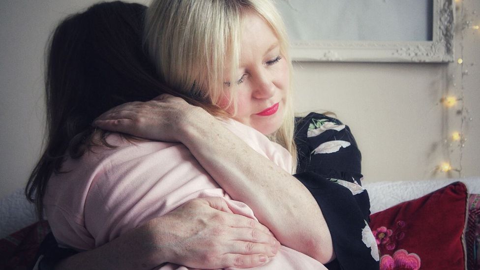 Tracy hugs her daughter