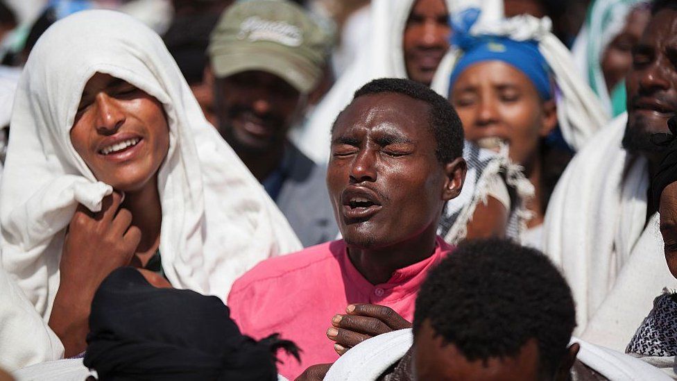 People mourn the death of Dinka Chala who was shot dead by the Ethiopian forces the day earlier, in the Yubdo Village, about 100 km from Addis Ababa in the Oromia region, on 17 December 2015