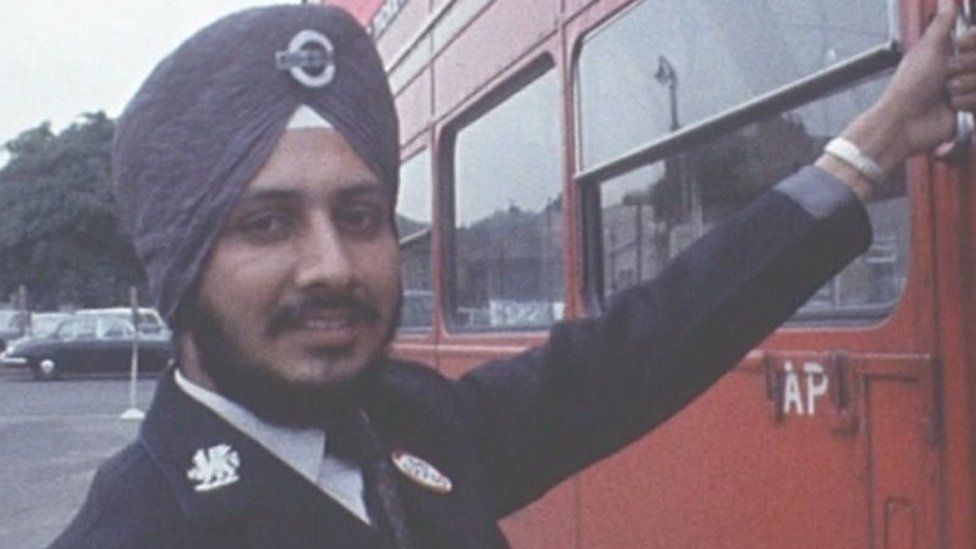 Tarsem Singh Sandhu, wearing his turban with his bus driver's uniform