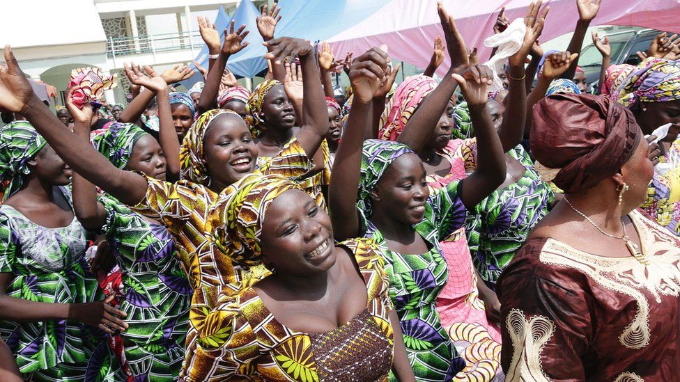 This handout picture released on May 20, 2017 by PGDBA ^ HND Mass Communication shows some of the released Chibok girls celebrating before being reunited with their families on May 20, 2017, in Abuja.