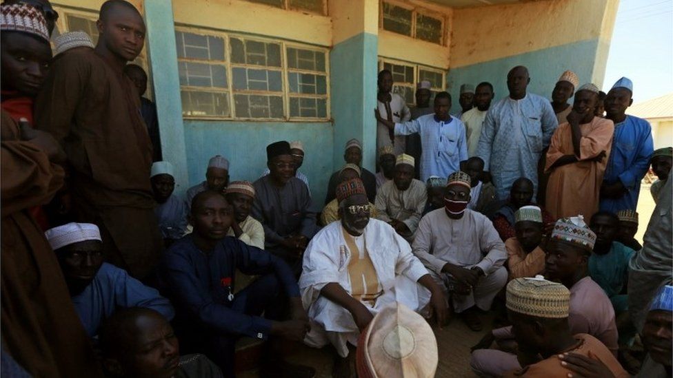 Parents gather during a meeting at the Government Science school after gunmen abducted students from it, in Kankara, in northwestern Katsina state, Nigeria December 13, 2020