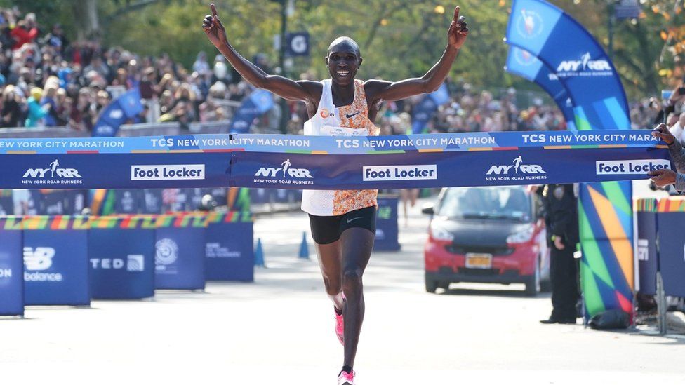 Geoffrey Kamworor of Kenya crosses the finish line to win the Professional Men's during the 2019 TCS New York City Marathon in New York on November 3, 2019.