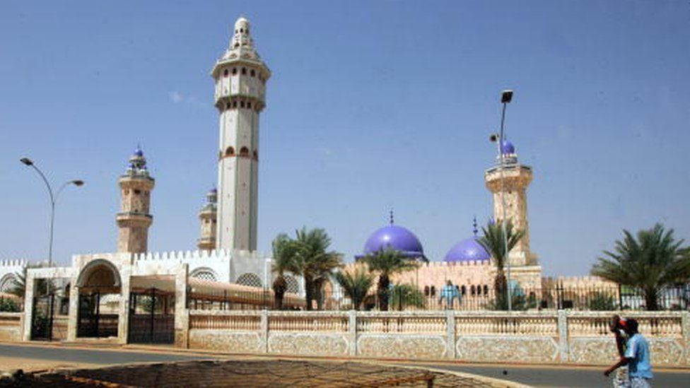 People cross the street in front of the Great Mosque in Touba, the holy city of Mouridism, 01 November 2007