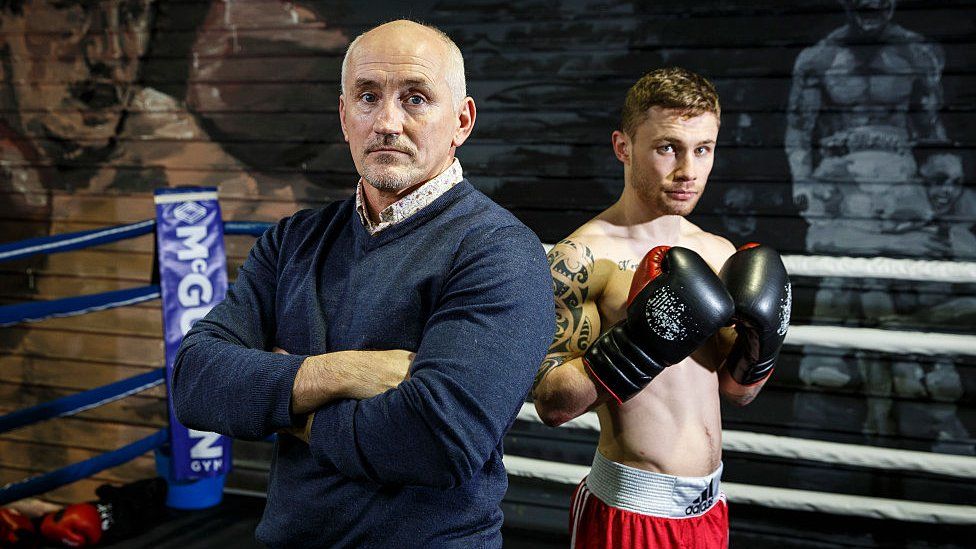 Barry McGuigan and Carl Frampton pose in the ring