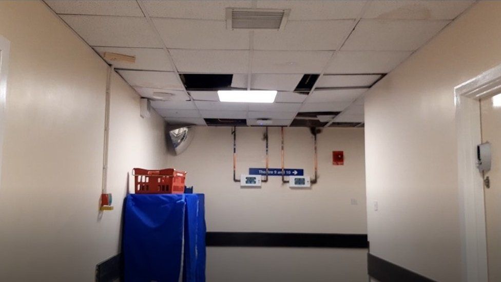 A ceiling inside the hospital with panels missing