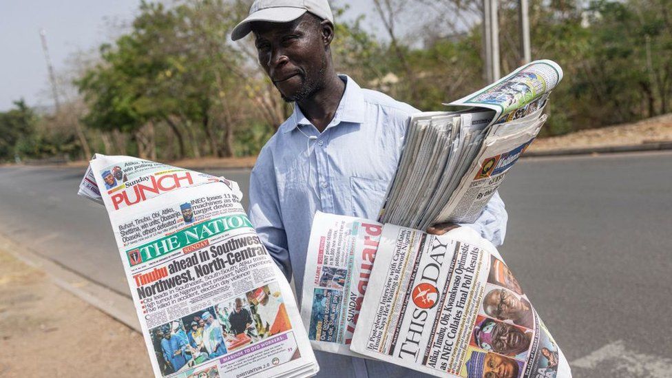 A man sells newspapers in Abuja on February 26, 2023
