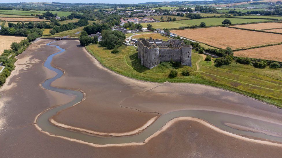 An aerial view during low tide in the Carew River which runs alongside Carew Castle