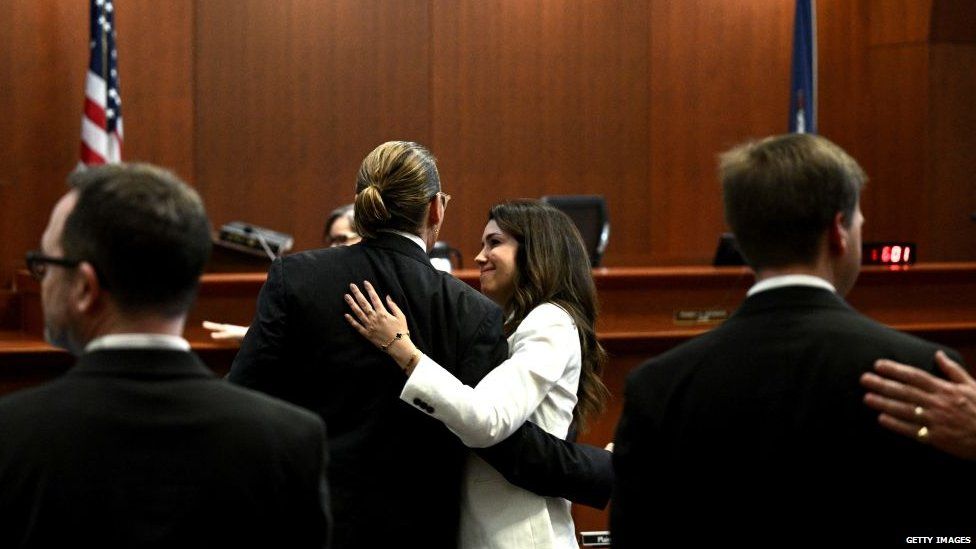 Johnny Depp hugs his lawyer Camille Vasquez