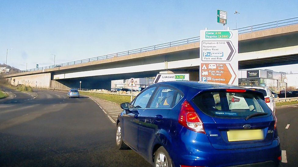 A car driver committing a motoring offence