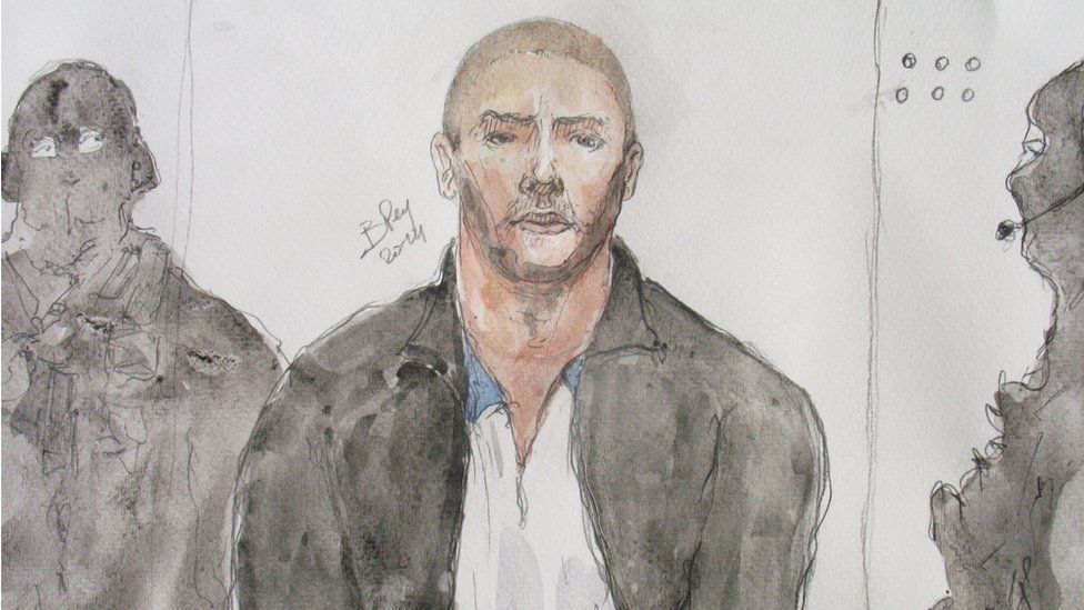 This file court drawing made on June 26, 2014, shows Mehdi Nemmouche (C), the 29-year-old suspected gunman in a quadruple murder at the Brussels Jewish Museum, during a court hearing in Versailles, France