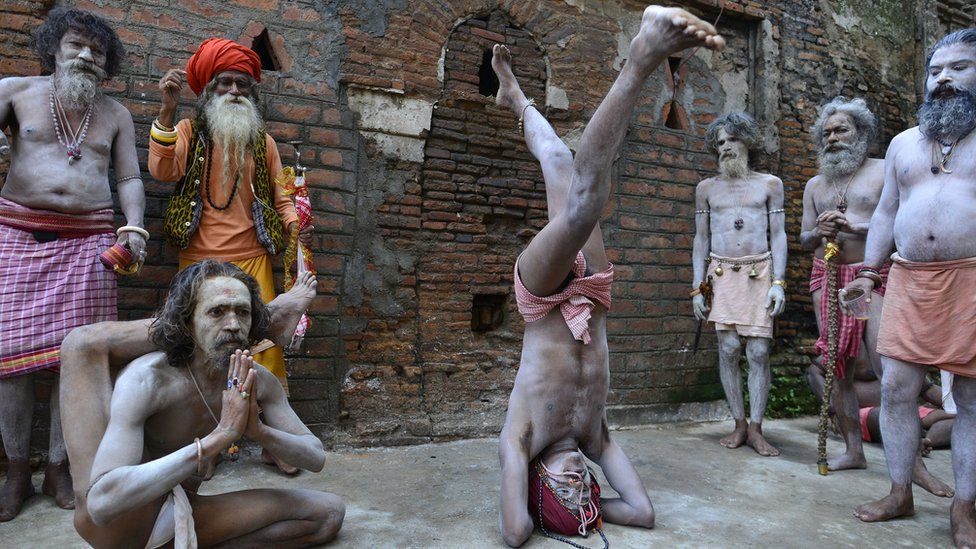 Indian Hindu holy men perform yoga on the occasion of the International Yuga Day during the annual Ambubachi festival in Kamakhya temple in Guwahati, Assam, India, 21 June 2017.