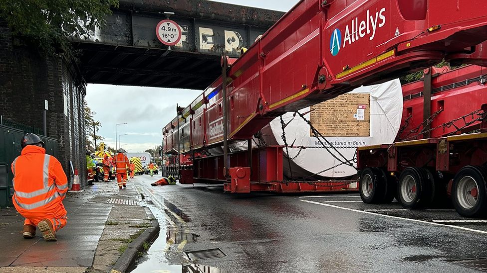 Abnormal load passing under a low bridge