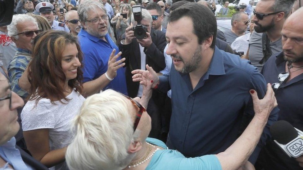 The leader of Italy's right-wing League - Matteo Salvini - meets a supporter