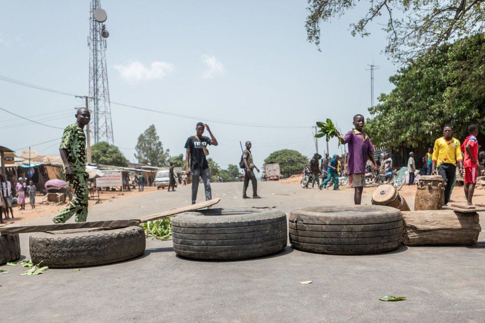 Protesters use tires to barricade the road in Toui, an opposition stronghold, on 7 April.
