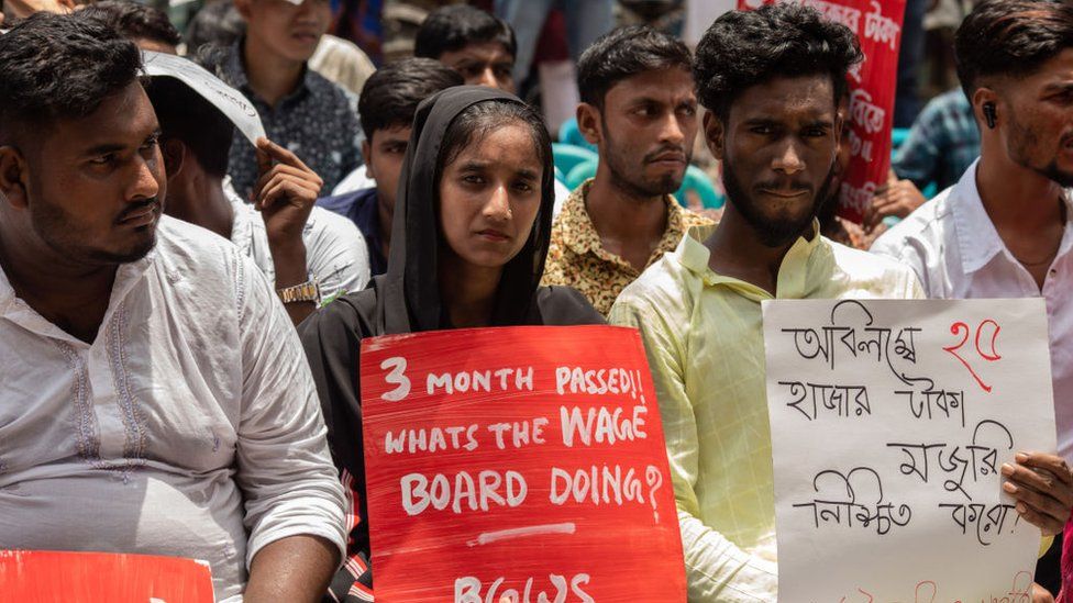 Protesters hold placards expressing their opinion during the demonstration. Bangladesh Garment workers gathered to demand an increase in the minimum wage.