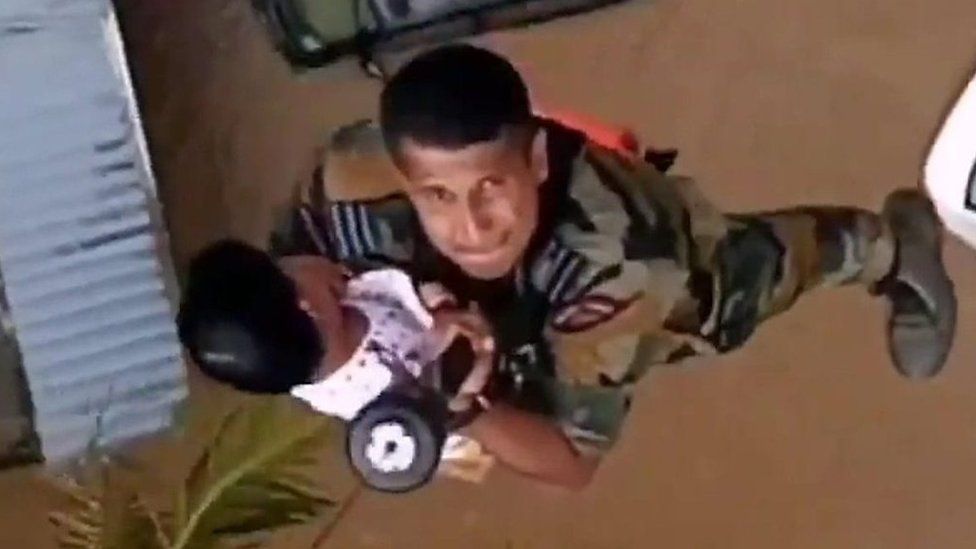 An Indian Air Force team rescue a toddler from a flooded building in Kerala