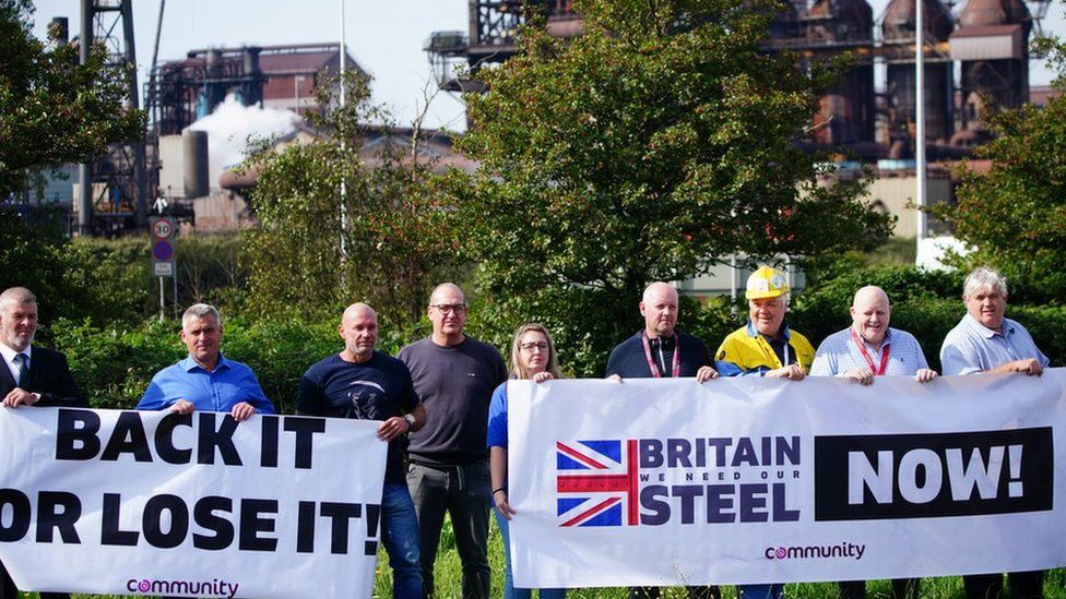 Workers outside Tata Steel's Port Talbot steelworks in south Wales, as around 3,000 jobs are at risk at the plant as part of a planned restructuring.