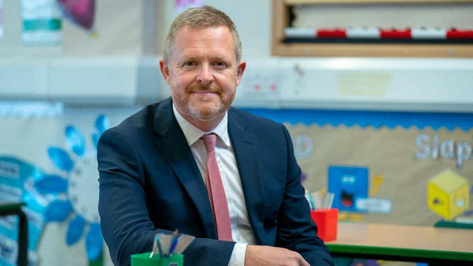 Education Minister Jeremy Miles pictured in a primary school