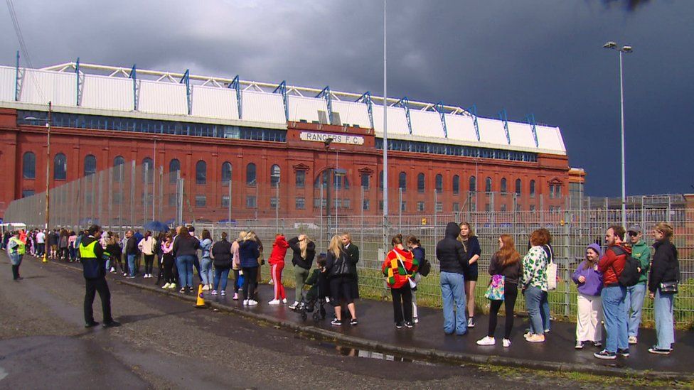 Fans queue at Ibrox stadium