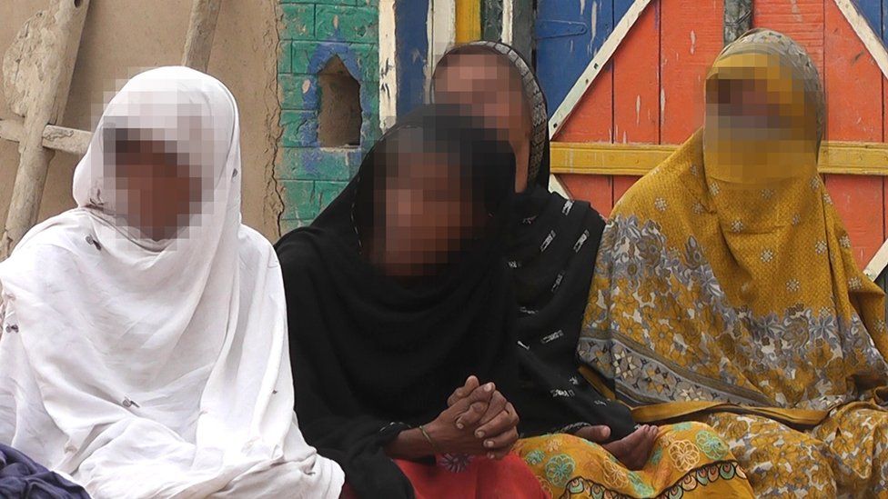 A picture of the 16-year-old girl who was paraded half-naked, with her female relatives. Their faces have been blurred to preserve their anonymity.