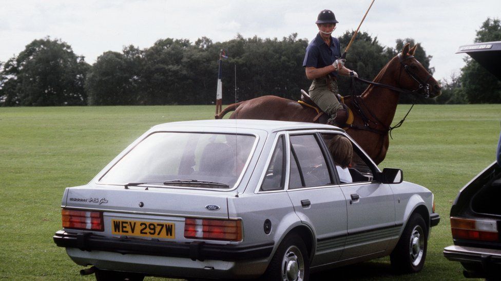 Princess Diana watching Prince Charles play polo in the car
