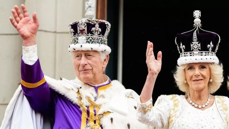 King Charles and Queen Camilla waving at the Coronation