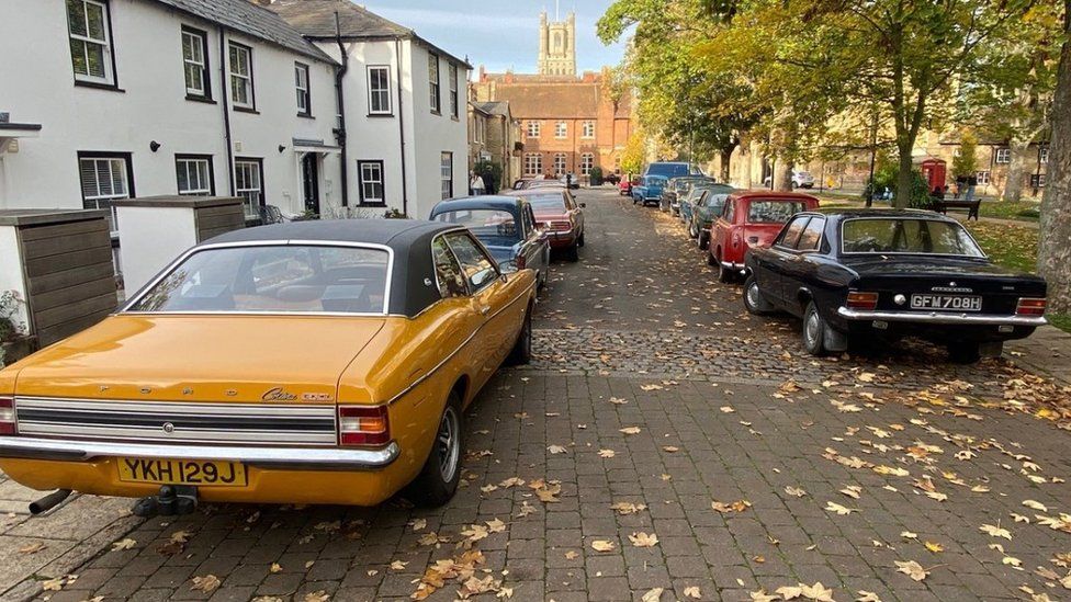 Old cars on a street in Ely