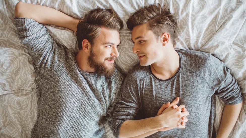 A gay couple in bed