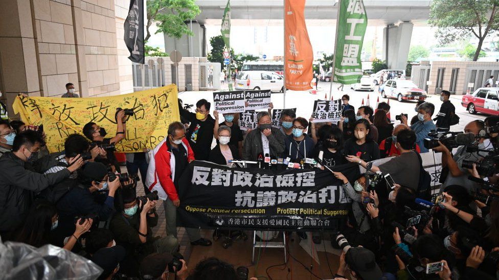 Pro-democracy activists including former lawmaker Lee Cheuk-yan (C) rally at the courthouse - 16 April