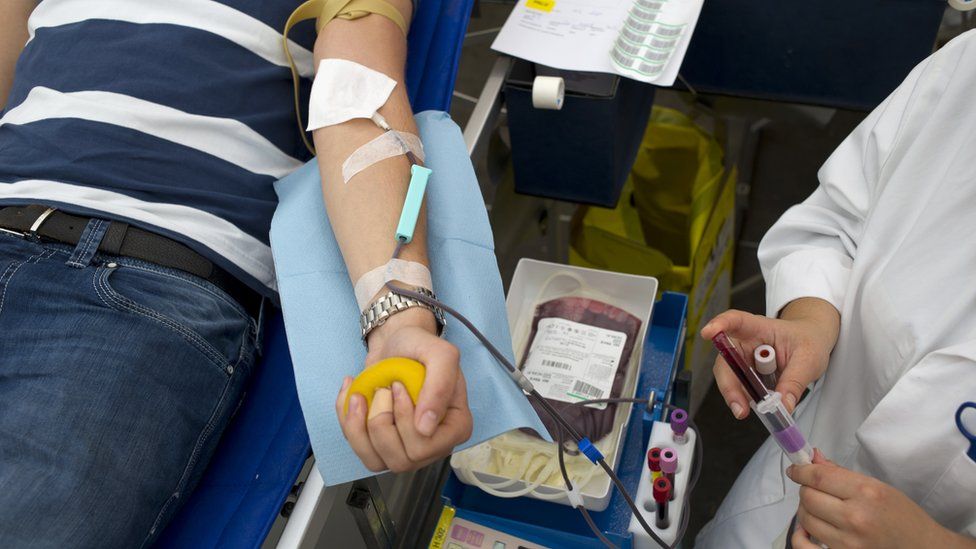 A man donates blood in 2014