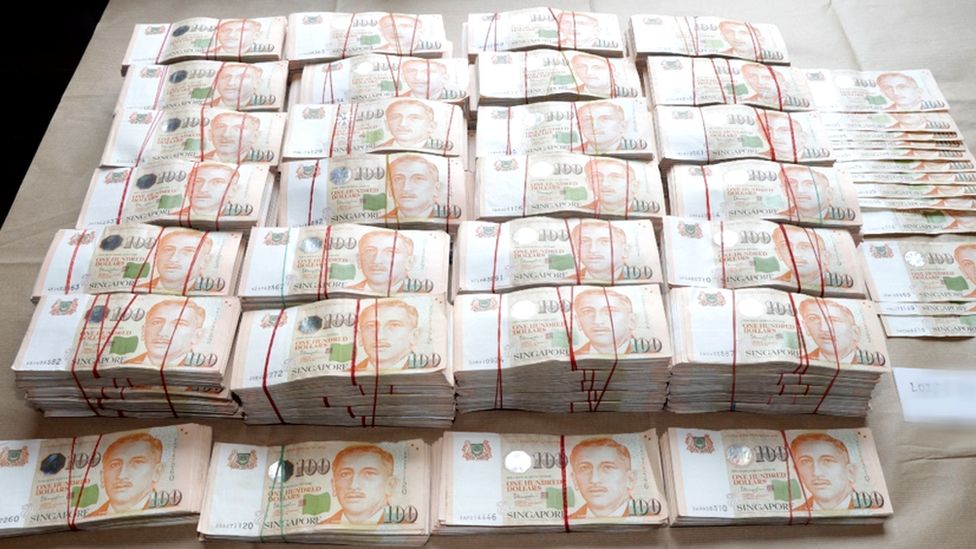 Cash seized by Singapore police.