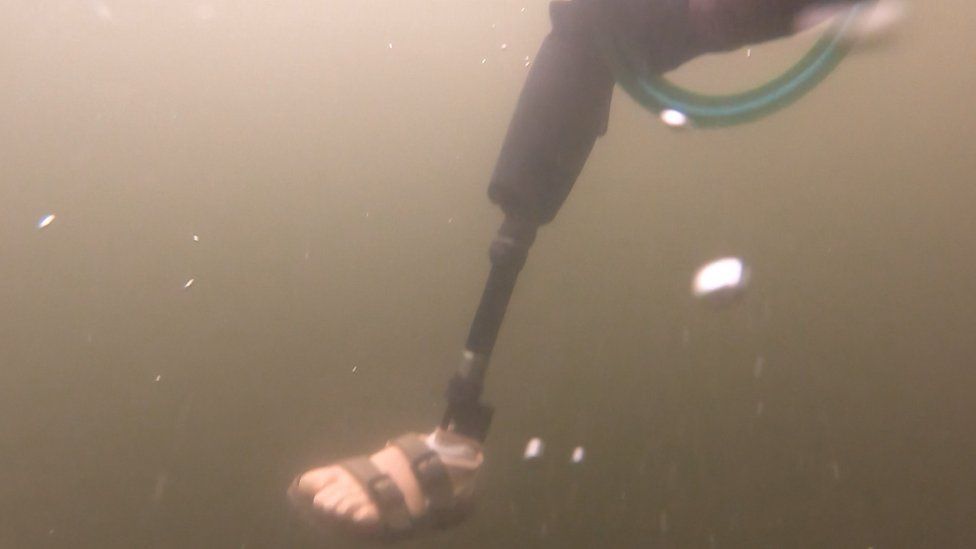 The prosthetic leg under the water