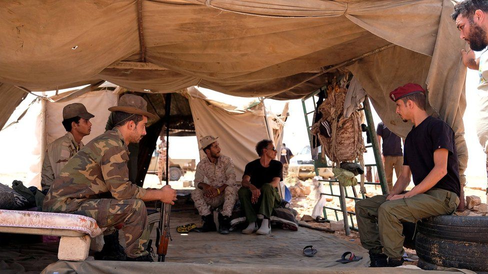 Members of the Libyan National Army (LNA) commanded by Khalifa Haftar sit inside a tent at one of their sites in west of Sirte, Libya August 19, 2020