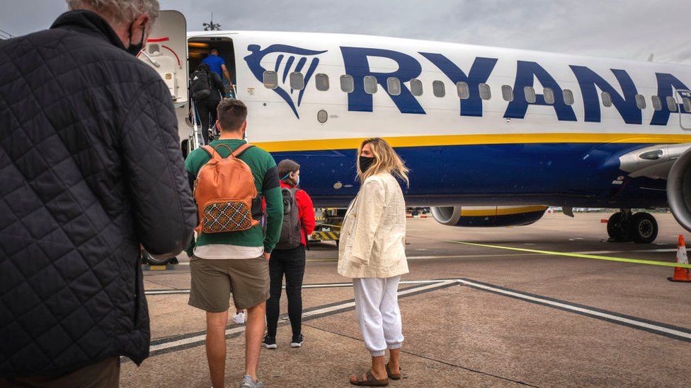 People boarding a Ryanair plane from City Airport, Manchester
