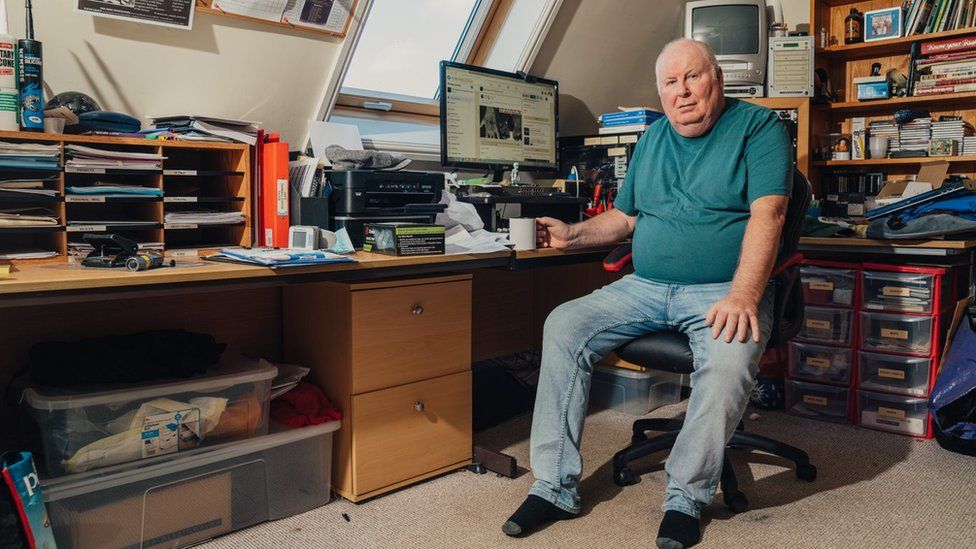 Man sitting at his computer screen