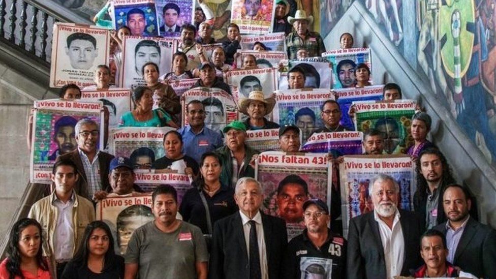 President Andres Manuel Lopez Obrador poses for a picture with relatives of some of the 43 students of the teaching training school in Ayotzinapa who went missing in 2014, at the Palacio Nacional, in Mexico City on September 11, 2019