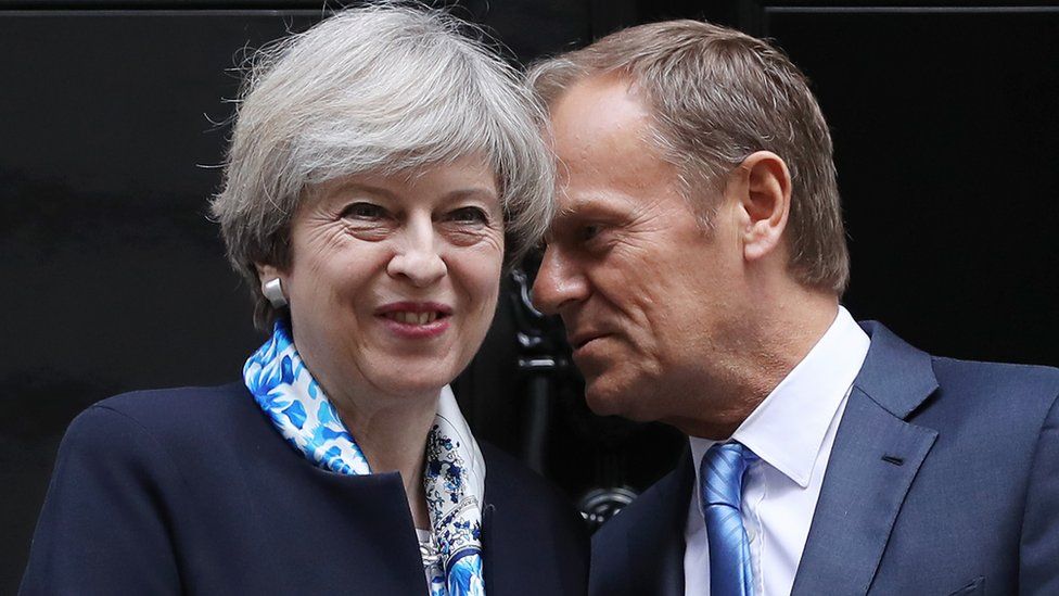 British Prime Minister, Theresa May, greets The President of the European Council, Donald Tusk, on the doorstep of 10 Downing Street on April 6, 2017 in London, England