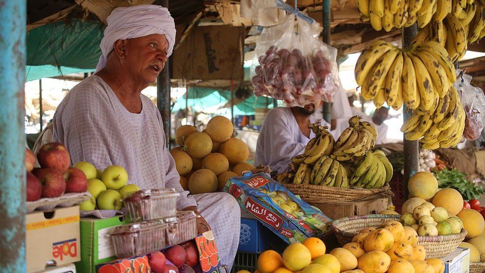 A Sudanese man sells fruit at a market in Shendi, the hometown of President Omar al-Bashir, located on the banks of the Nile in Sudan's Arab heartland 190 kilometres (120 miles) from Khartoum on April 1, 2015