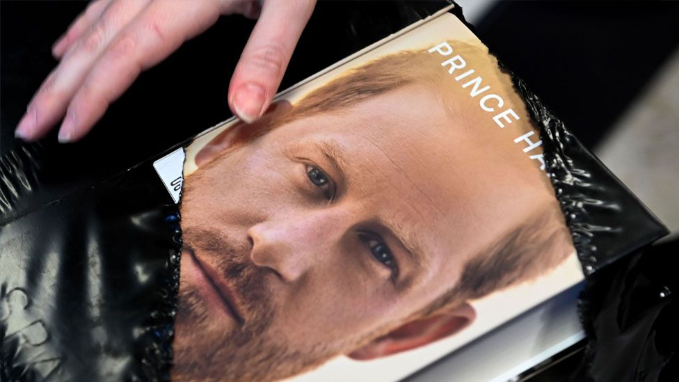 A shop worker unpacks copies of Prince Harry's memoir Spare during a midnight sale at a book shop in London, Britain, 10 January 2023