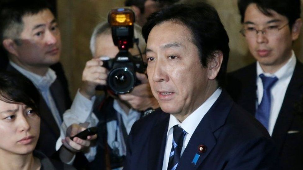 Japan's Trade Minister Isshu Sugawara speaks to the media at the parliament in Tokyo on October 25, 2019. -