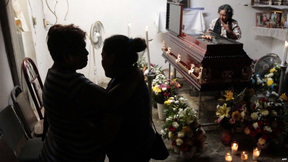 Relatives and friends attend the wake of community leader Miguel Angel Jimenez Blanco in Xaltianguis, Guerrero State, Mexico, on August 9, 2015.