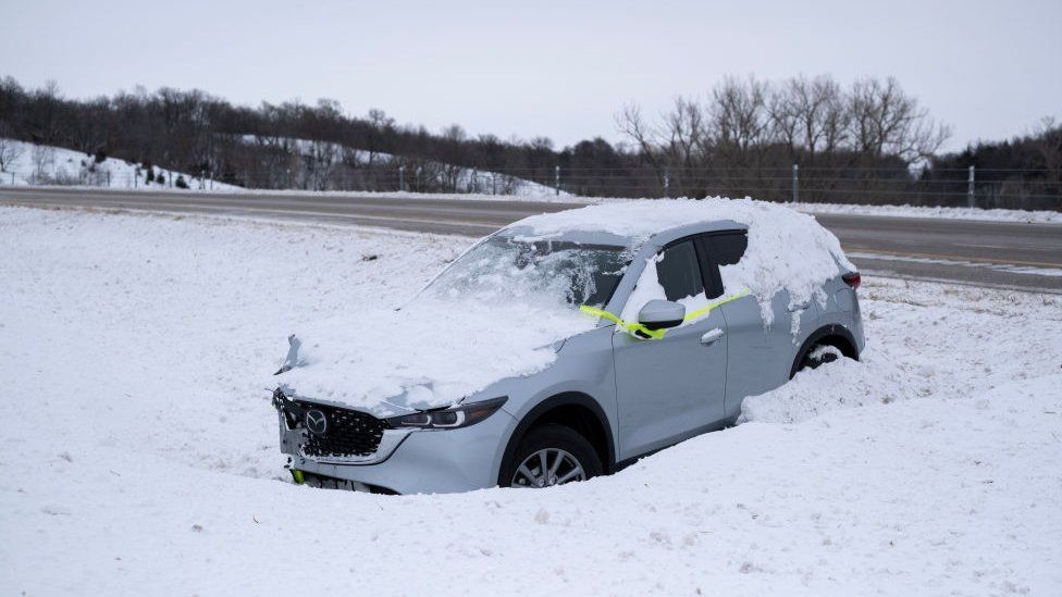 Car after winter storm in Iowa