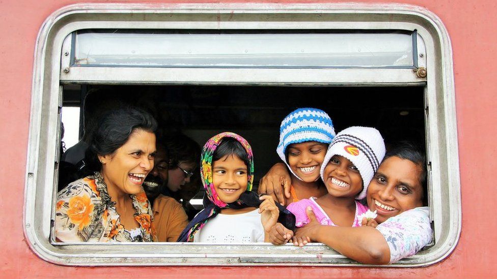 Sri Lankan family in train window