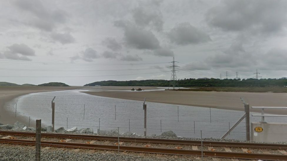Pylon on the Dwyryd estuary with the rail line in the foreground