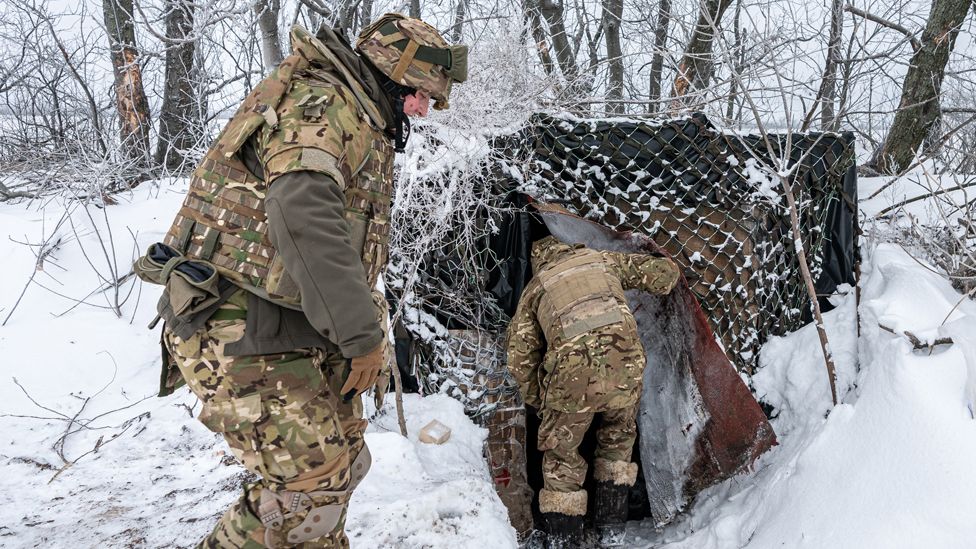 Ukrainian soldiers return to their bunker at the Bakhmut frontline, in Donetsk Oblast, Ukraine on 10 January 2024