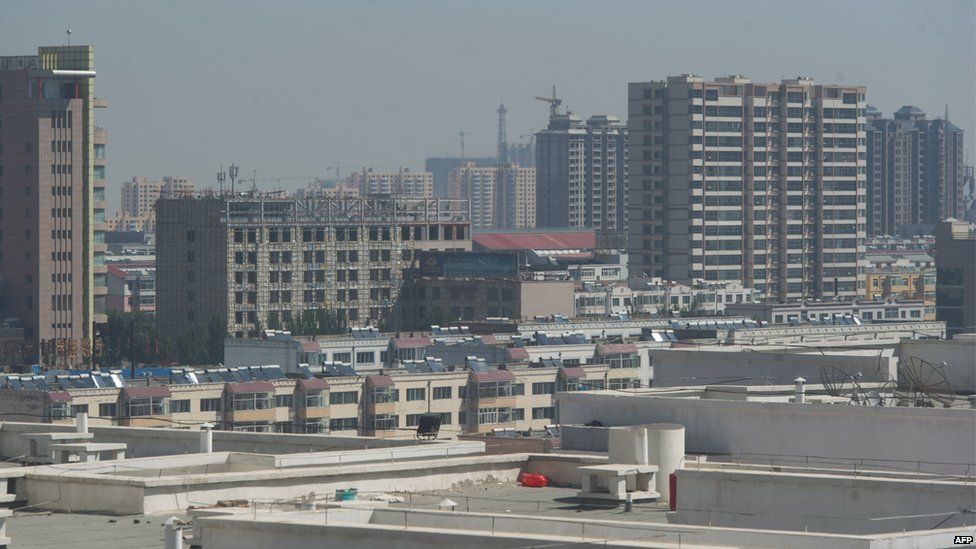 File photo: A general view shows the skyline of the Dongsheng district of the inner Mongolian city of Ordos on 19 August 2012