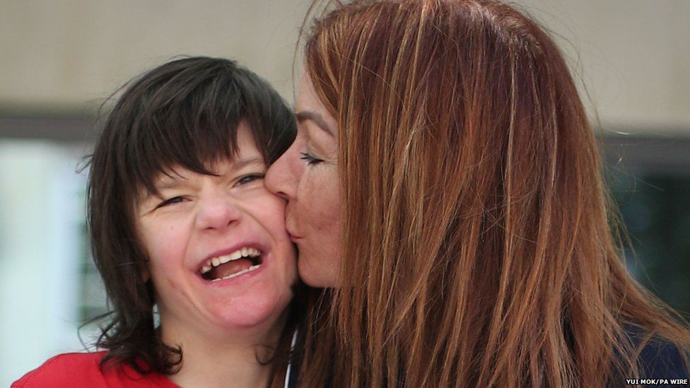 Billy Caldwell and his mother. She kisses his face