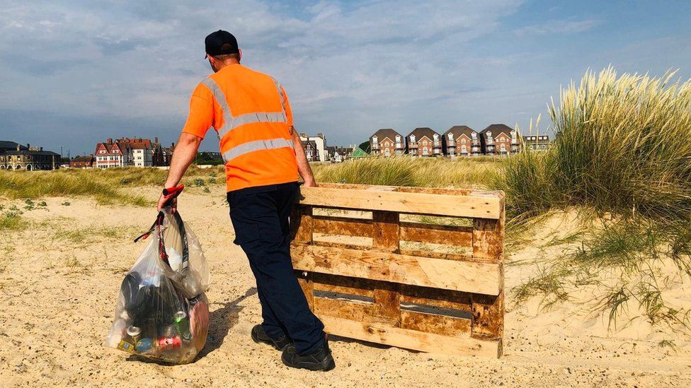 A litter picker on Great Yarmouth beach