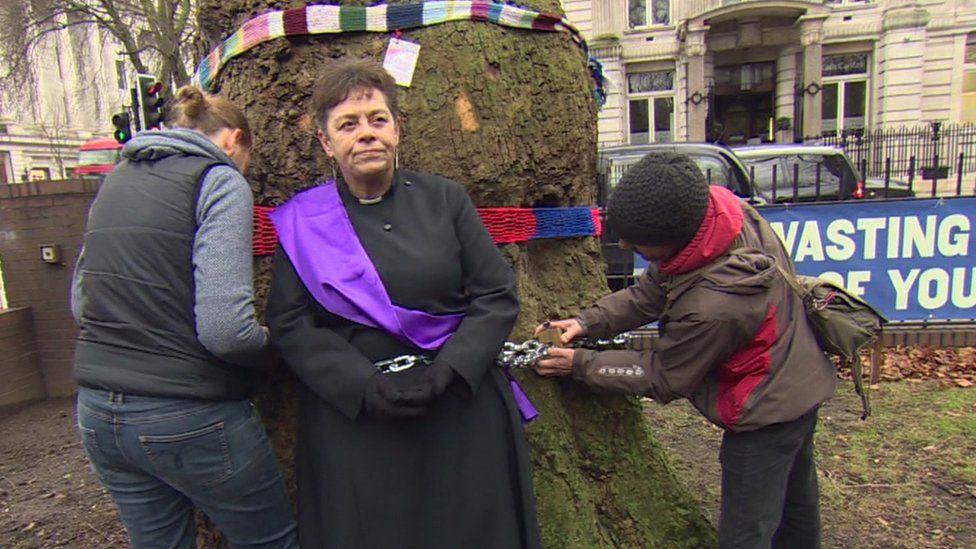 Rev Anne Stevens being chained to a tree